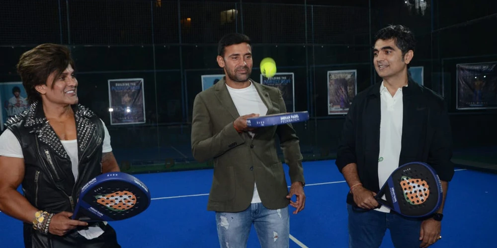 Yash Birla Standing With 2 Guests Holding Racquet